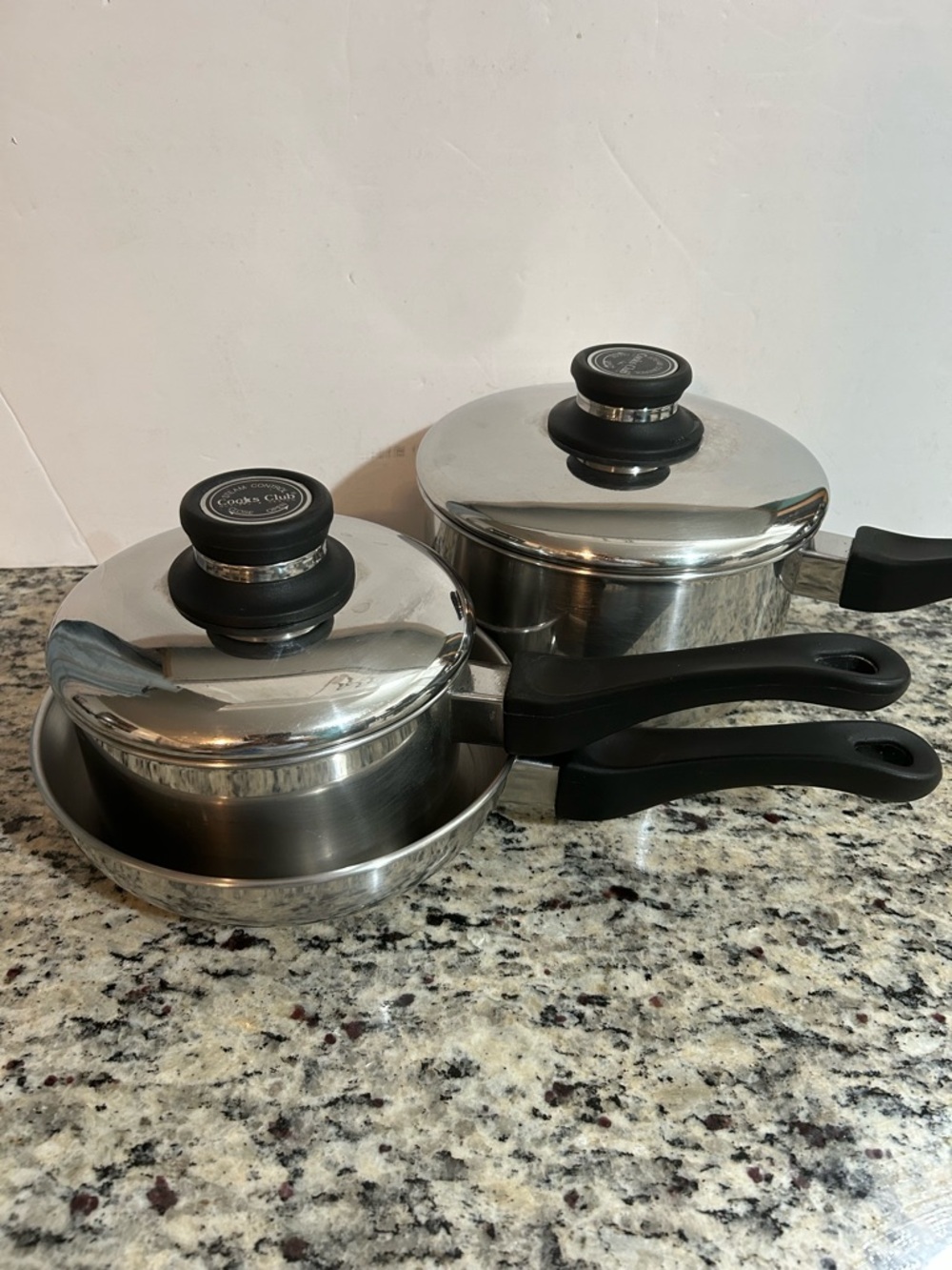 Stainless Steel Cookware Set with Black Handles and Lids